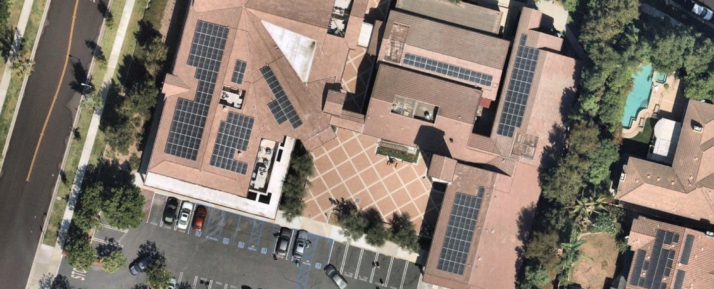 top down view of solar panels on a business roof